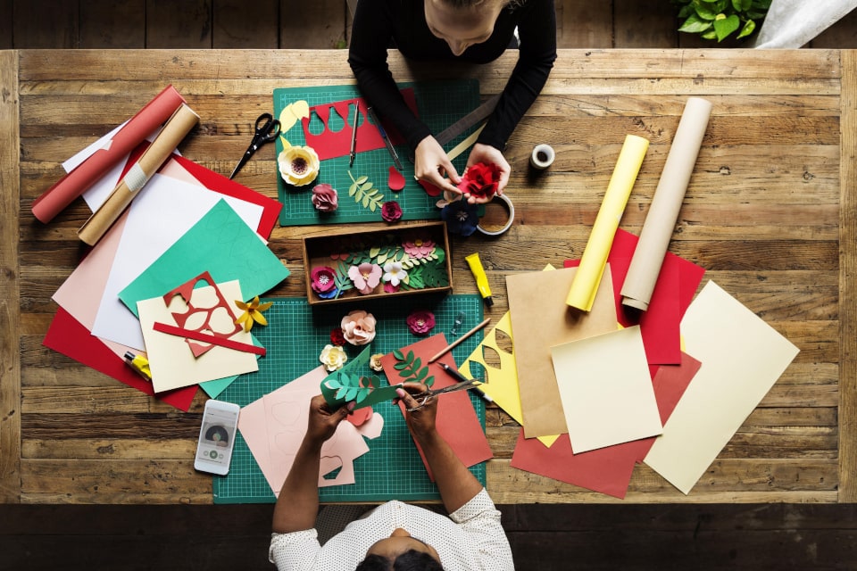 Crafting influencers at a table doing crafts