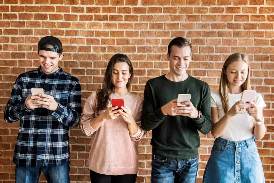 Four people using smartphones