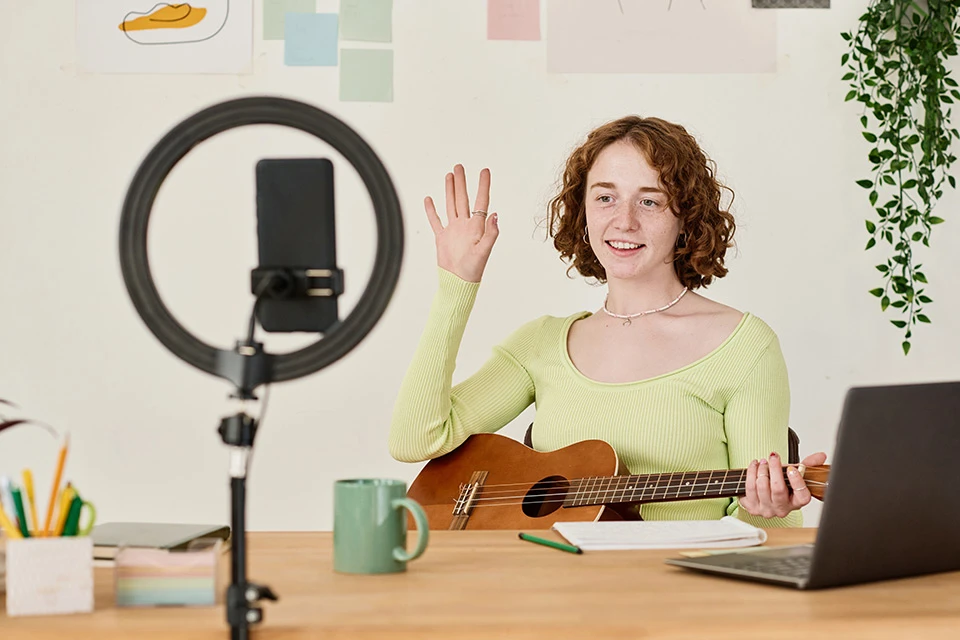 influencer making a music video with a ukelele