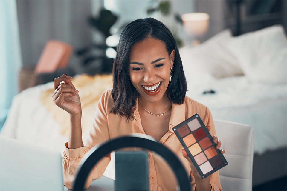 Beauty influencer making a video review on a makeup palette