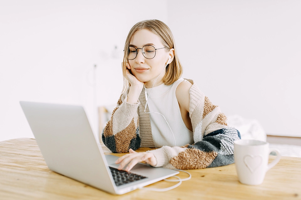 Influencer marketing manager at work on a laptop