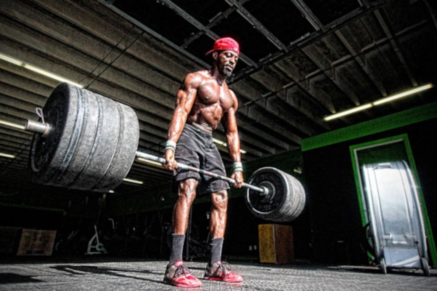 FitTok creator working out by lifting