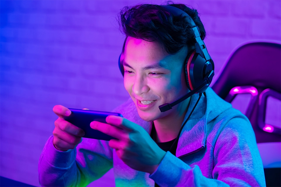 Mobile gamer participating in mobile game marketing on a smartphone