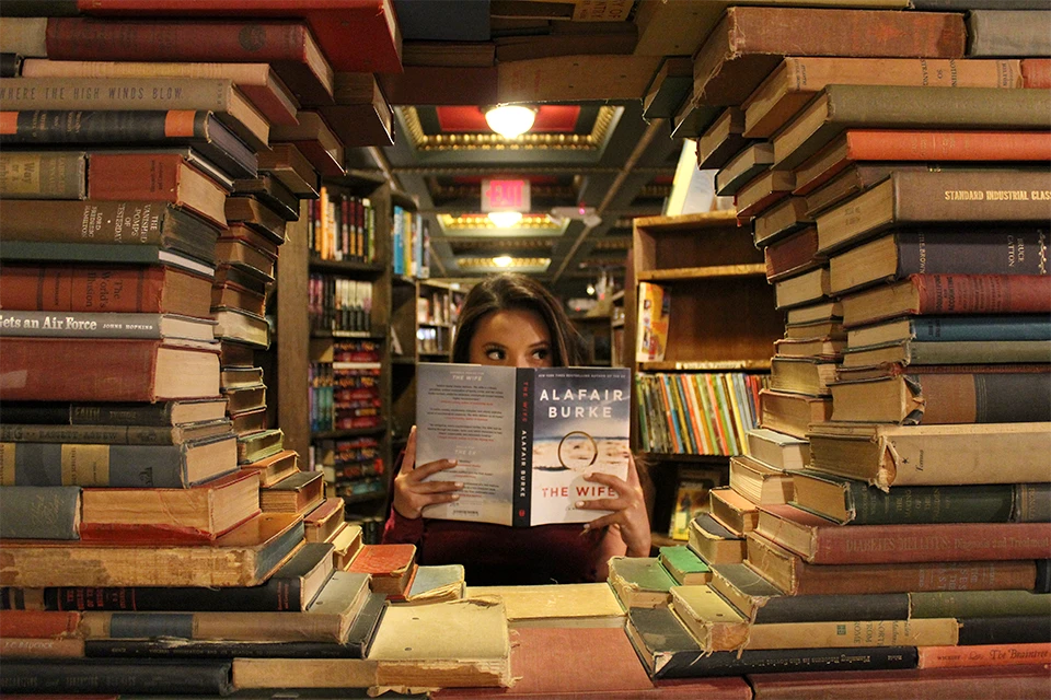 Person surrounded by books