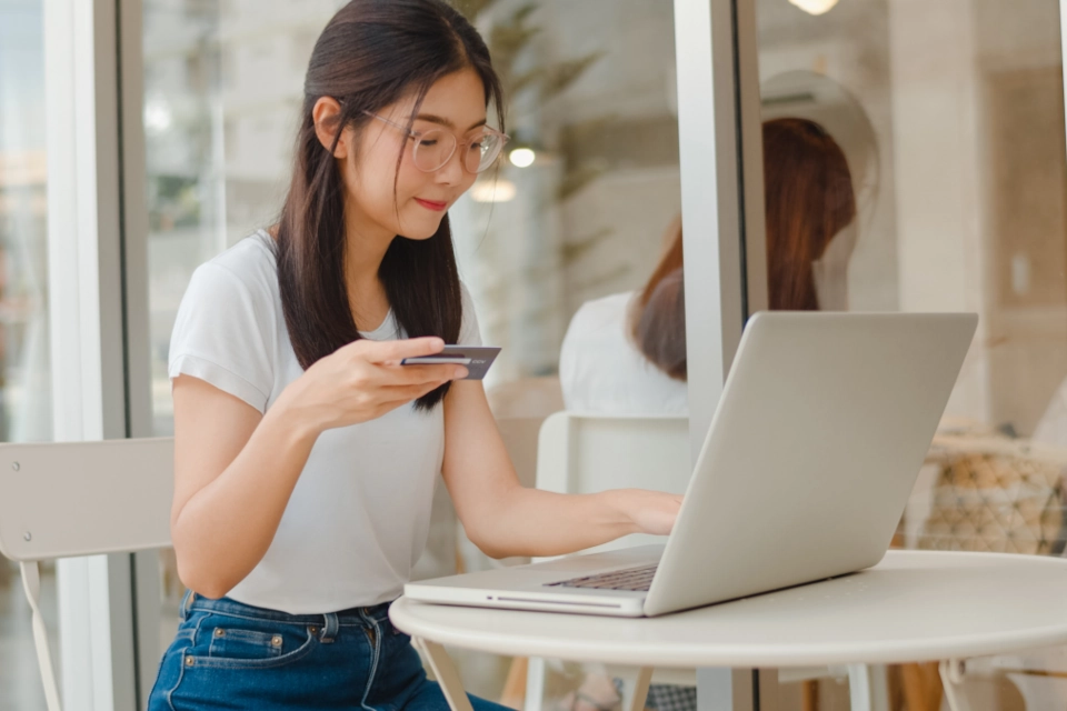 Woman shopping on a laptop